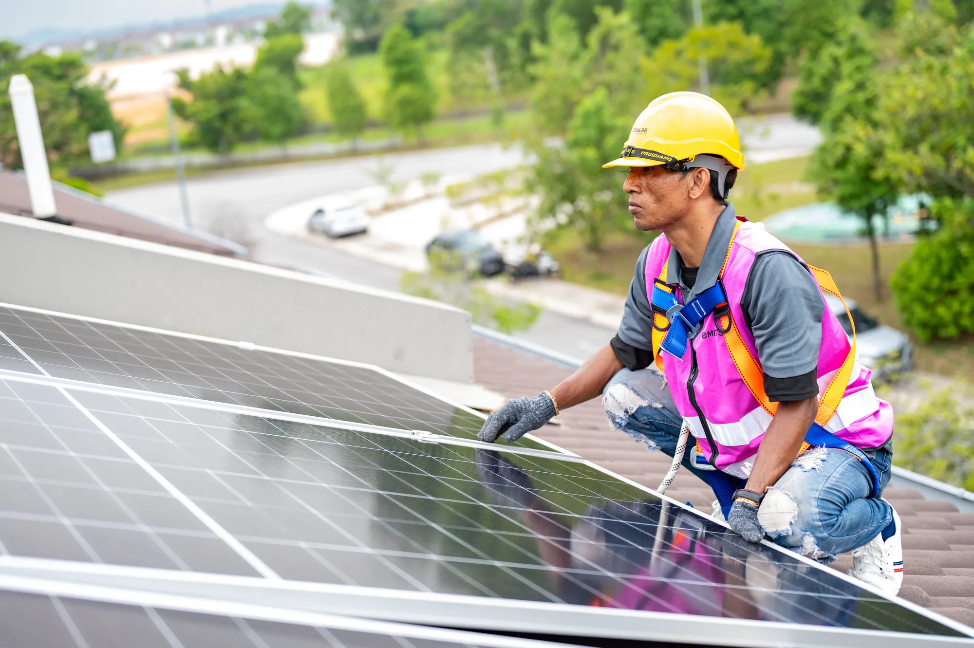 Time Solar installer working on a rooftop array